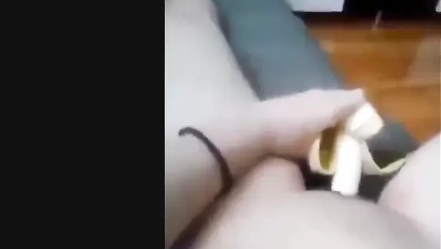 Asian babe with a banana orgasms in her pussy